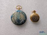 a gold locke and a blue locke with a picture on it
