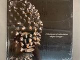 a book with a picture of a pine cone on it