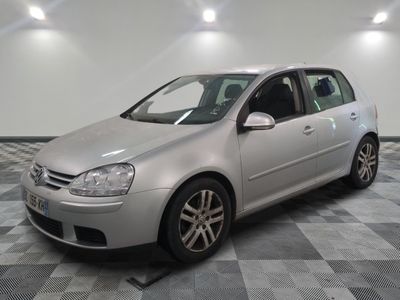 a picture of a silver car parked in a garage