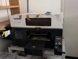 a printer that is sitting on a cart in a room