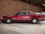 a red car that is parked in a garage