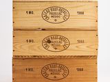 three wooden boxes that are stacked on top of each other