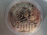 the coin is in a plastic container on a table