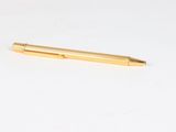 a pen that is laying on a white surface