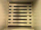 a wooden crate in the corner of a room