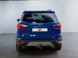 the rear end of a blue ford escape parked in a garage