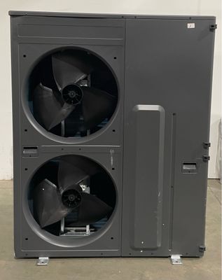 an air conditioner with two fans on top of it in a room