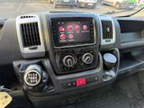 a dashboard of a truck with a lot of buttons on it