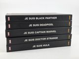five books stacked on top of each other on a white surface