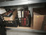 a lot of boxes and crates on the shelf