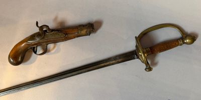 two old weapons on a white surface