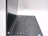 a laptop that is open on a white surface