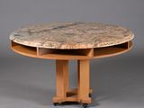 an image of a round table with a marble top on casteors