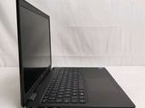 a black laptop with a black keyboard on a white surface