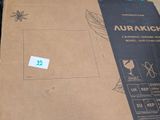 a cardboard box with a sticker on it sitting on the floor