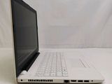 a laptop that is sitting on a white table