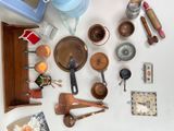 many different types of kitchen utensils laid out on a table
