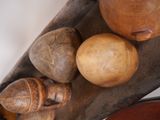 many different types of wooden objects displayed on a table