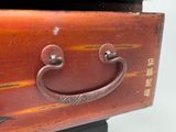 a close up of a brown suitcase with a handle