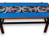 a blue table with a red and black design on it