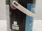 a can of paint sitting on a table with a white handle