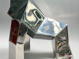 a metal sculpture of a dog made out of tin foil