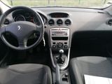 the interior of a car with a steering wheel and dashboard controls