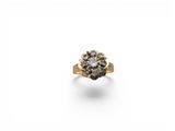 an image of a diamond cluster ring on a white background