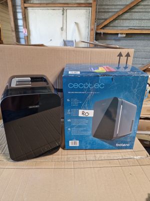 a box with a black and silver toaster and a box with a black and white toaster