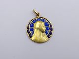 a close up of a gold and blue medallion with a man ' s face