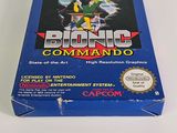 the box for the game bionic command is sitting on a white surface