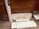 a marble bench sitting in front of a dresser in a room