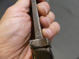 a person holding a knife in their hand