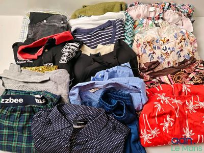 a lot of clothes that are sitting on a table