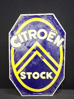 un panneau bleu et jaune sur lequel on peut lire « Citroën Stock »