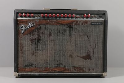 a close up of a guitar amplifier sitting on top of a table