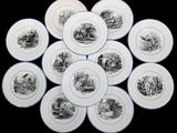 nine plates with black and white images of animals on them
