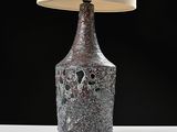 a lamp that is sitting on a table next to a lamp