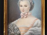 portrait of a lady with a bouquet of flowers in a black frame