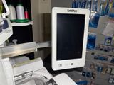 a computer monitor sitting on top of a printer