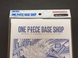a box of one piece base shop cards on a table