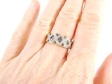 an image of a woman ' s hand with a diamond ring on it