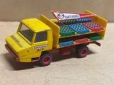 a toy truck that has a bunch of legos in the back