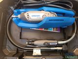 a tool in a box with wires and a cord