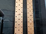 two wooden boards on the wall next to a microphone