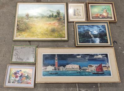 many framed pictures on the floor next to each other