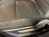 a seat in the back of a car with a remote control