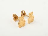 a close up of a pair of gold teddy bear earrings