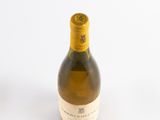 a bottle of wine that is sitting on a table