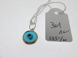 a tag with a blue evil eye on it